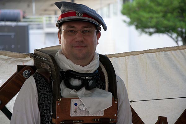 Steampunk costumer with wooden backpack ensemble