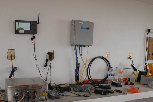 Photograph of equipment on a counter and hung on the wall.