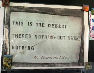 A quote is stamped into it: "This is the desert. There's nothing out here. Nothing."