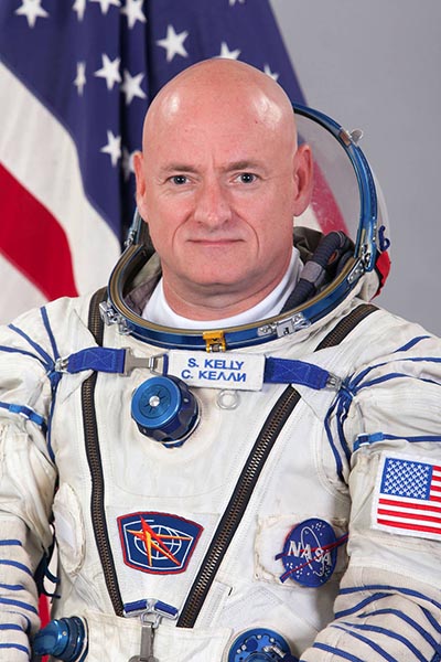 Portrait of Scott Kelly in his astronaut suit.