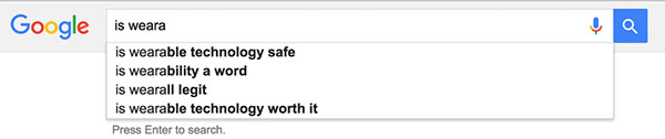 Screenshot of the Google search bar with the terms "is weara" typed in. Autocomplete below it suggests "is wearable technology safe," "is wearability a word," "is wearall legit," and "is wearable technology worth it".