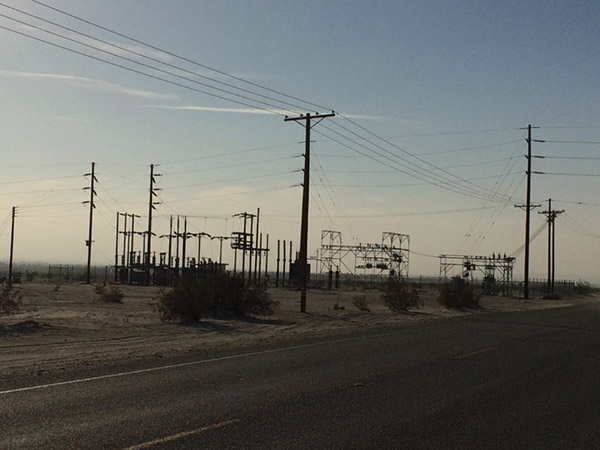 An electrical substation weathers the clouds of dust kicked up by a nearby off-road vehicle recreation area. Photo by author.