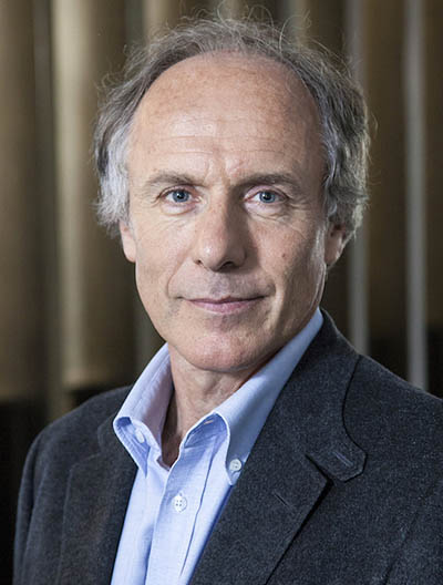 Portrait of Dr. Alan Finkel in a blue dress shirt and jacket facing the camera.