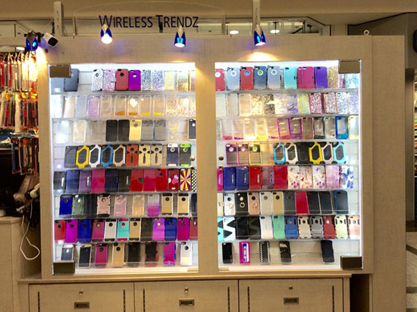 An image of two display cases at a mall kiosk, containing a colorful array of cell phone cases.