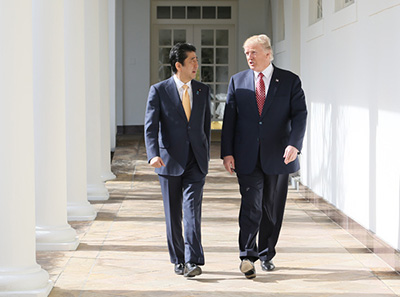 Shinzo Abe and Donald Trump, walking together and speaking