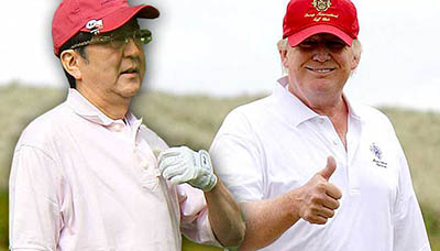 A picture of Shinzo Abe and Donald Trump in golf attire. Trump is giving a thumbs up to the camera.