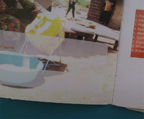 Photograph of a booklet. On the left page is a photograph of a person pouring water from a yellow jug into a teal bowl.