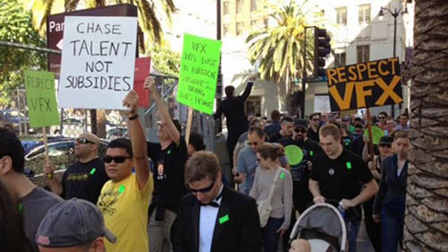 Demonstrators march with signs in front of the 2014 Oscars. The signs read "Chase talent not subsididies" and "Respect VFX".