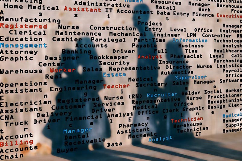 Rendering of a wall with job titles listed all over it. There are shadows cast on it from people walking past.