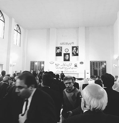 Men gathered at a meeting in a large hall. Seminar organized by Pakistan Bar Council on the law of Sedition titled National Dialogue: Unconstitutional curbs on the Freedom of Speech