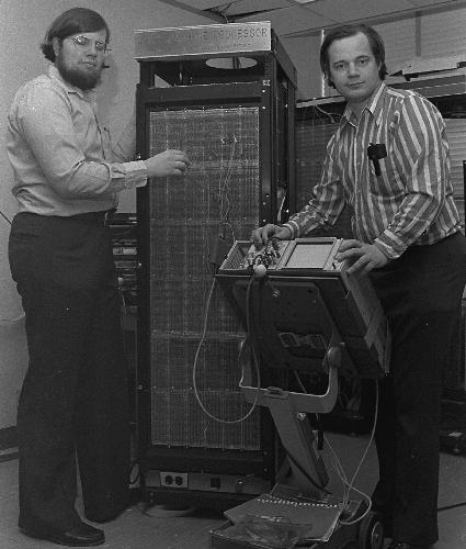 Thomas Knight and Richard Greenblat stand next to LISP computer they developed