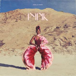 Album cover art from Janelle Monáe's hit track Pynk. The image shows Janelle Monáe, a black woman, wearing a pink outfit standing in a desert beneath a blue sky. 