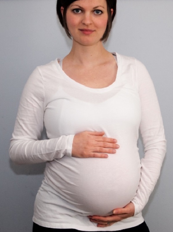 Dr. Dielentheis poses confidently pregnant with her son as representation of confidence in her health and her growing child's as she would have been vaccinated for the COVID-19 Pandemic if it had occurred six years ago.