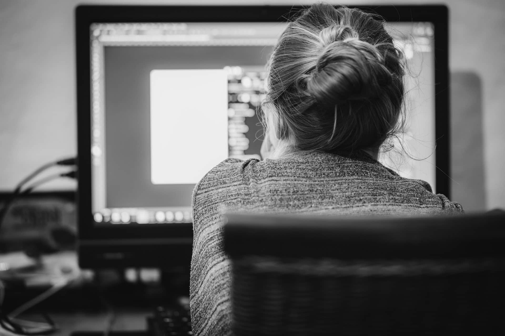 Woman staring at a computer screen