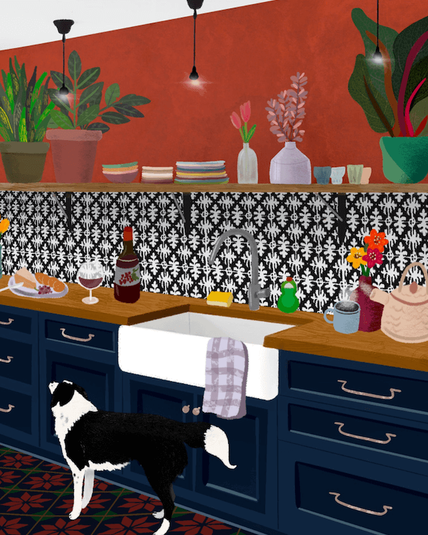Frank the dog stands sniffing the air in front of deep blue kitchen cabinets, a wooden counter top, black-and-white tile backsplash, and deep rust-red walls above.