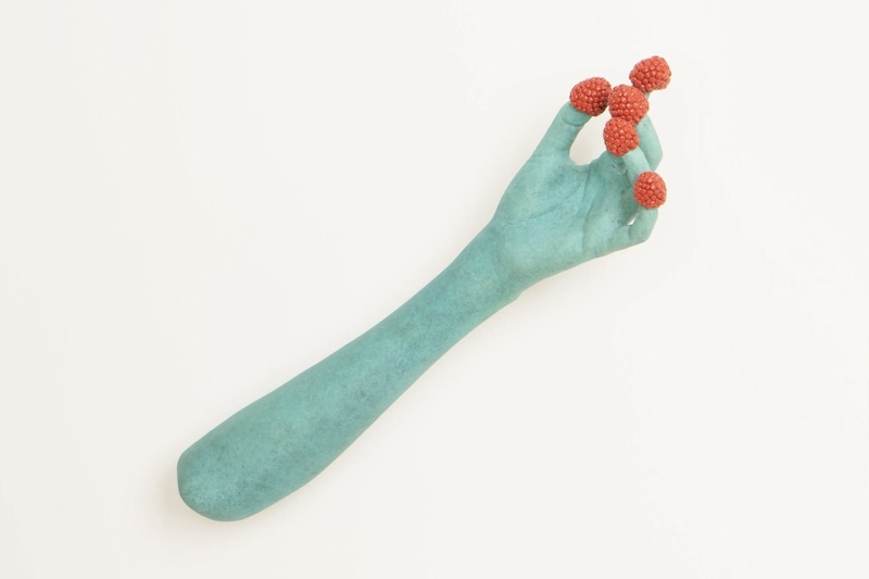 The image captures a moment of making mold while making sculpture.