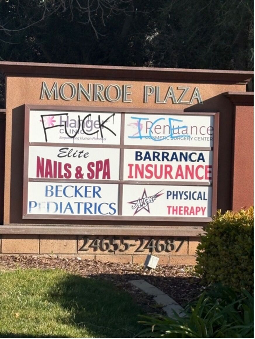 FUCK ICE is graffitied on some local banners