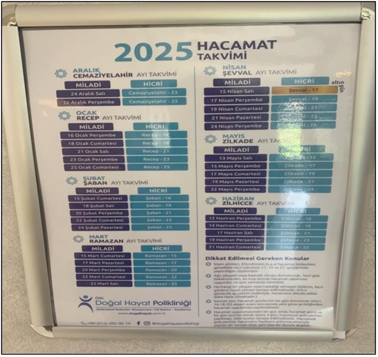 A wall-mounted 2025 hijama calendar in a clinic lists recommended treatment dates by month using both Gregorian and Islamic lunar calendars.