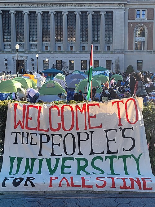 A sign in front of an encampment stating: "Welcome to the People's University for Palestine".
