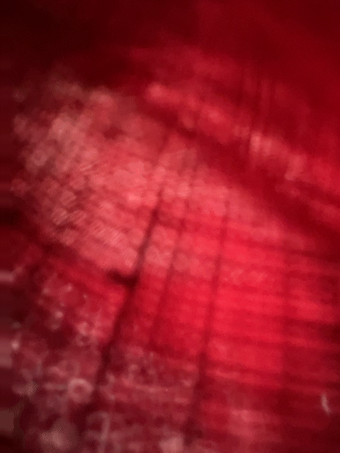 A swirl of pink and light as if through fabric. A curtain or a skit? Could this be a pocket?